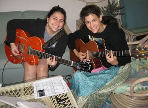 Maggie & I playing Beatles tunes on our guitars.